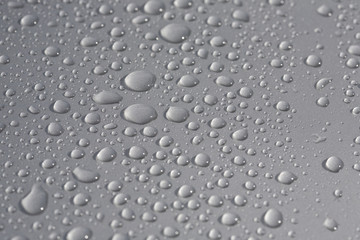 rain drops on metallic surface