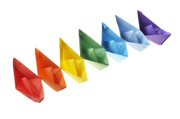 Seven paper ships of different color