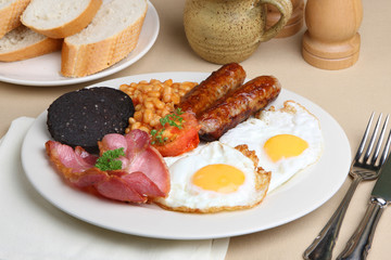 English fried breakfast with baked beans and black pudding