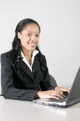 young woman executive working at her desk in office