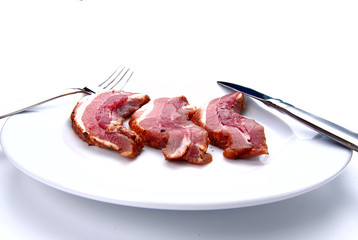bacon slices on white plate