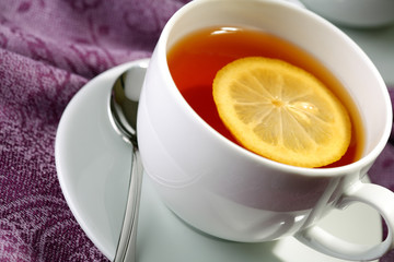 Hot teacup with lemon.