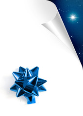Turning white paper page with blue Christmas bow