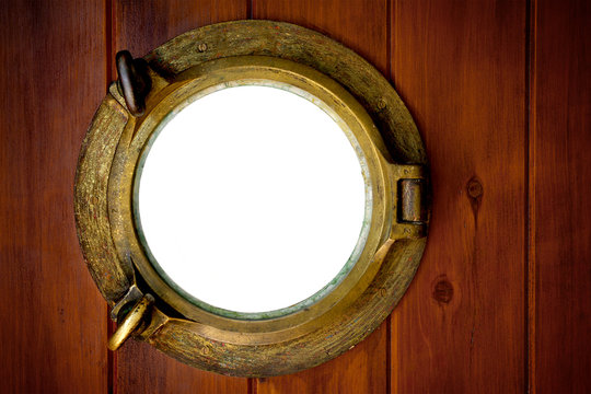 Close-up of a closed boat porthole with wihite background