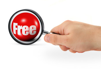 searching for bargain - hand with magnifying glass