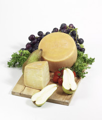 seasoned cheese on cutting board isolated on white