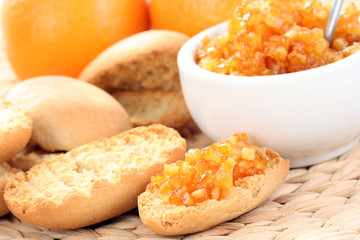Fototapeta na wymiar delicious breakfast - hot toast and orange jam