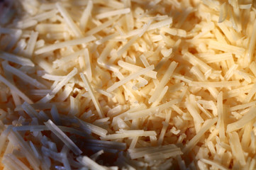 Grated asiago cheese shot with a shallow depth of field..
