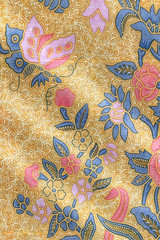 Yellow batik sarong with floral motif and a butterfly