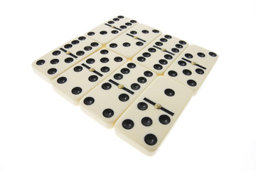 Arrangement of Dominoes on White Background