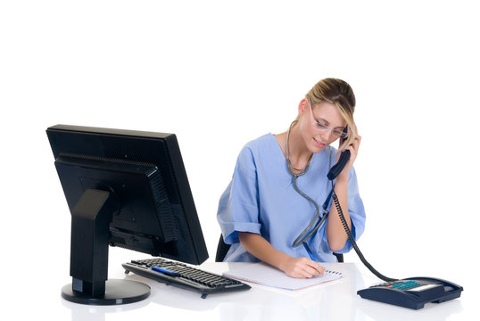 Attractive female doctor making phone call with patient,