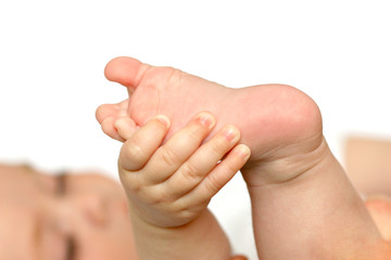 new born baby foot on white background