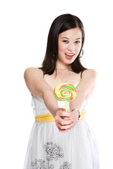 A beautiful asian woman holding a colorful lollipop