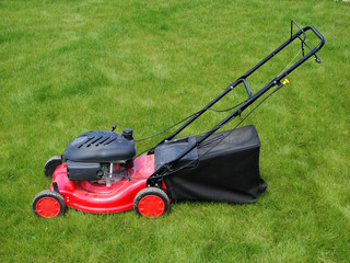 Lawn mower in the  grass