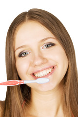 Girl cleans her teeth with tooth-brush