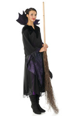 classical witch in black dress with broom isolated on white