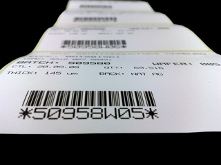 Roll of labels with the printed bar codes and figures.