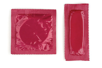 Two pink condoms in square and rectangle packaging on white