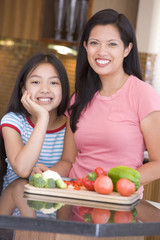 Mother And Daughter Preparing meal,mealtime Together