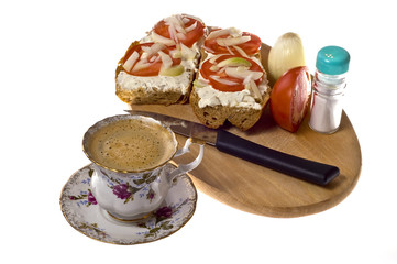 small breakfast - tomato, bread, cheese, onion and coffee