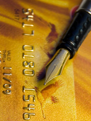 Golden Credit Card and pen