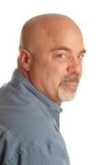 confident bald man looking over his shoulder