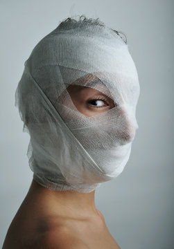 Young man portrait with bandaged face close up Stock Photo