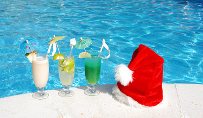 Santa hat and cocktails near the swimming pool