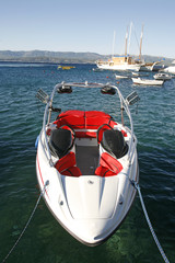 Fast modern motor boat docked in harbour , Croatia