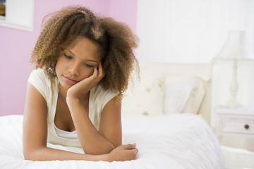Obraz na płótnie Canvas Teenage Girl Lying On Bed