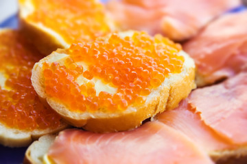 Caviare sandwich and salmon. Shallow dof.
