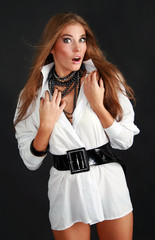 Sexy girl in shirt looks surprised