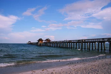 Abwaschbare Fototapete Fishing pier at municipal beach, Naples, Florida, Gulf of Mexico © Eugene Kalenkovich