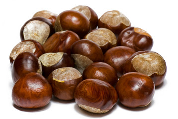 a few brown chestnuts are on a white background