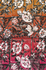 Red batik sarong with white floral motif