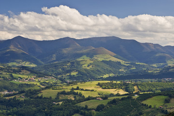 Fototapeta na wymiar Rural landscape with cloudy sky in North of Spain