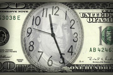 close up shot of a clock in  100 American dollar