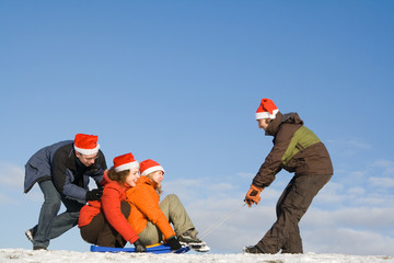 People having fun at sunny day at winter