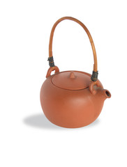 Isolated ceramic teapot with wicker wooden handle
