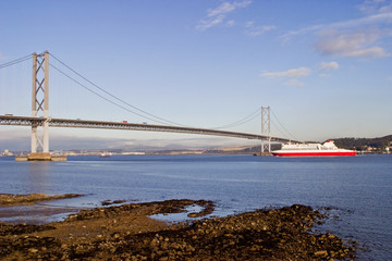 Ferry under the Forth Bridge at South Queensferry Scotland