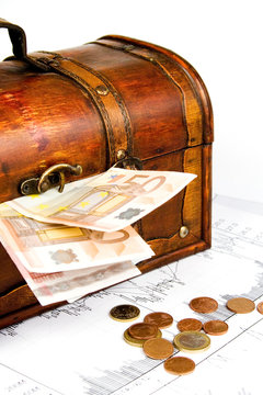 Business financial concept with diagrams chest and euro money