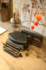 fall  arrangement on wooden table with typewriter