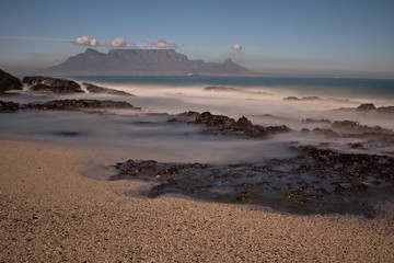 Table Mountain from Bloubergstrand with misty water