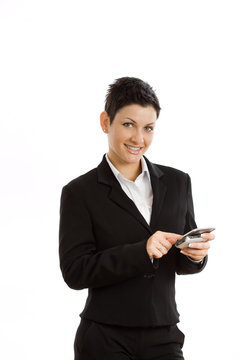 Happy businesswoman using mobile phone, smiling,