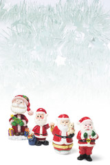 Composite of Santa Figures and Tinsel