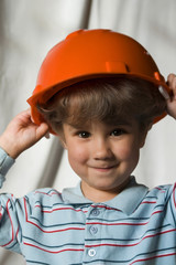 The kid in a building helmet