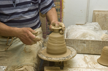 Potter's hands creating new ceramic