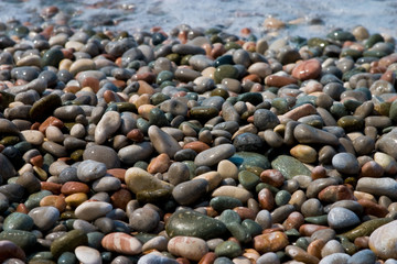 nature series: texture of wet sea pebblees