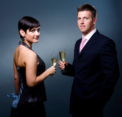 Couple drinking champagne on a party.