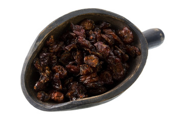 dried cranberries on a primitive, wooden, scoop, isolated